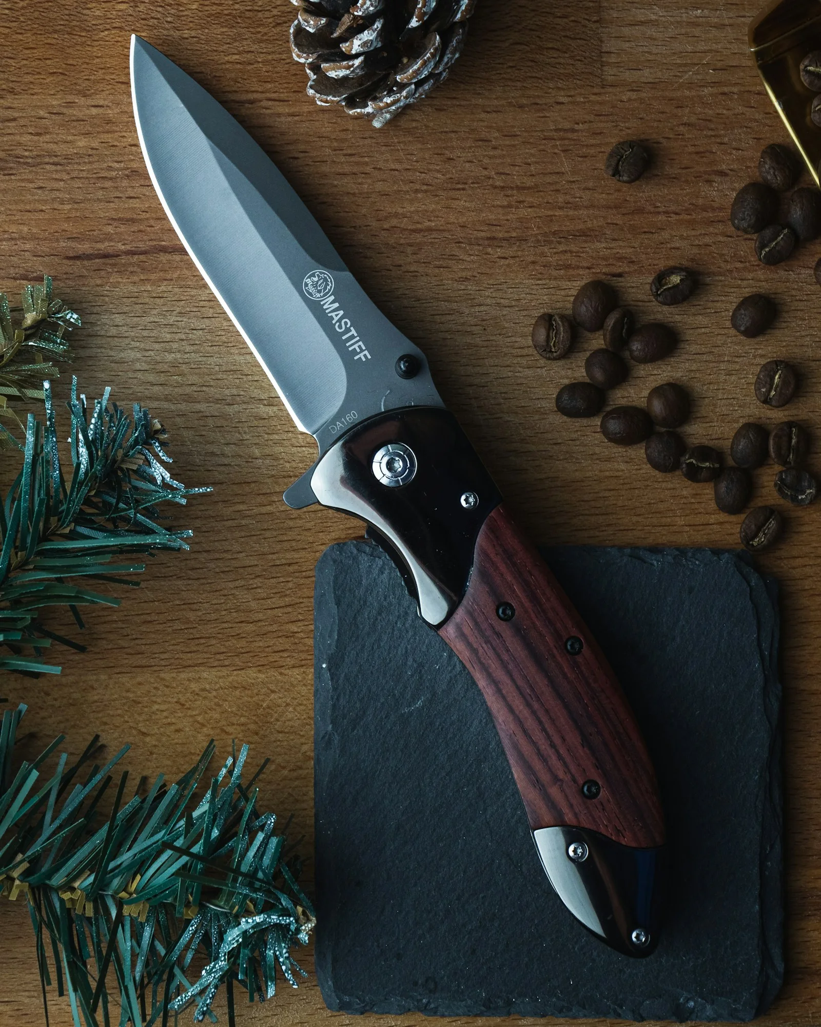 A folding knife on a wooden table