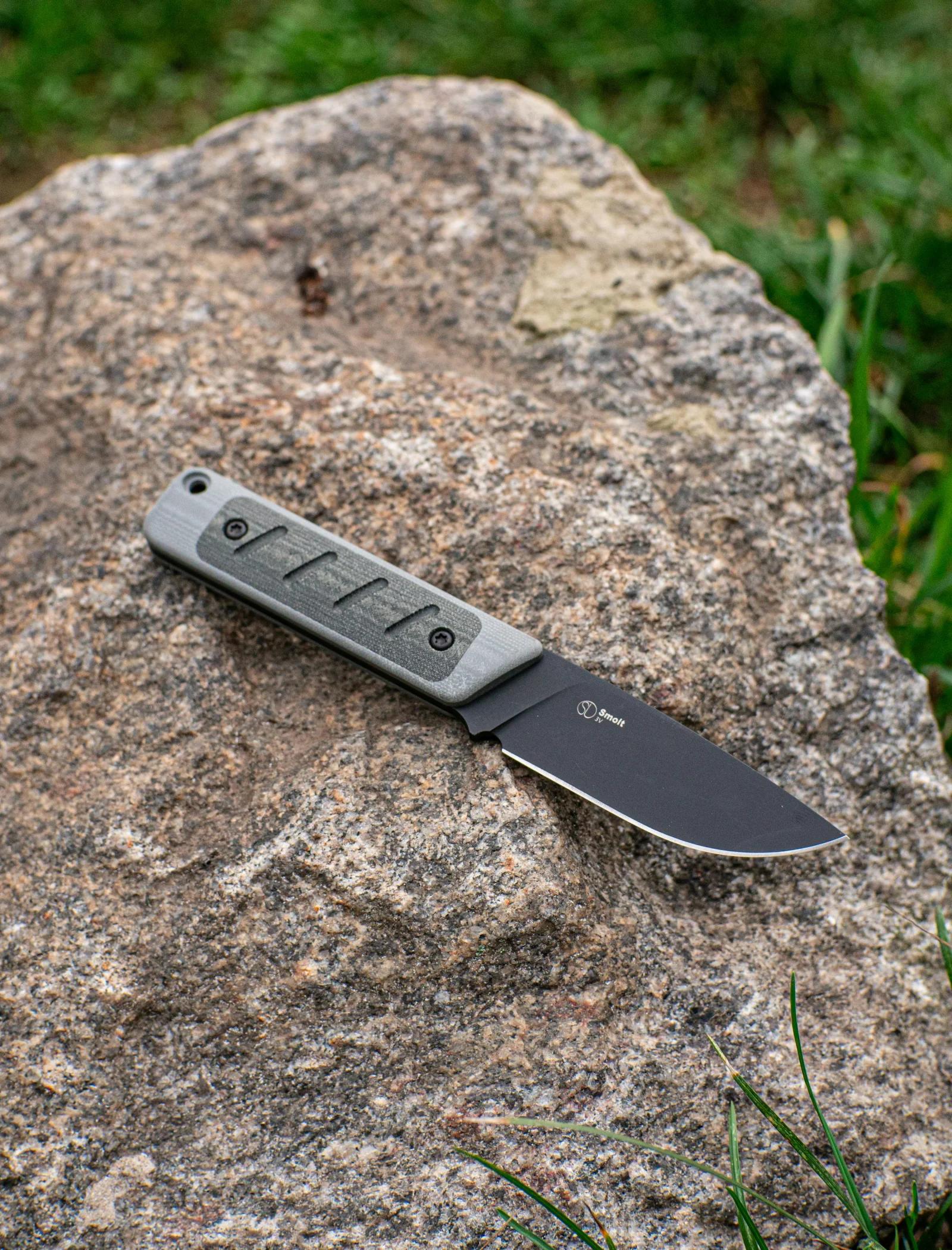 A knife resting on textured rock