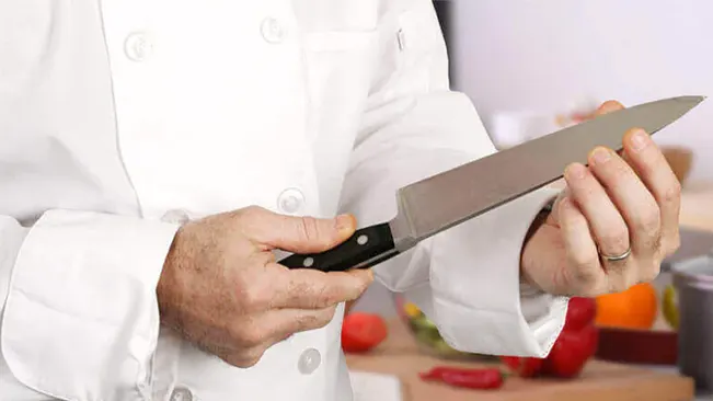 Chef inspecting a knife