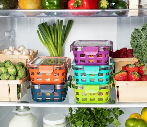 refrigerator organized with various fresh produce and colorful stacked food containers