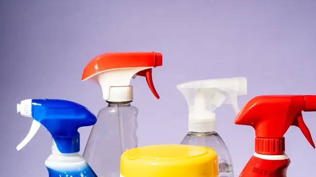 Various colored spray bottles of chemical sanitizers